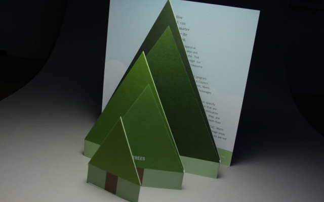 An accordion folded row of trees grows progressively larger in a brochure